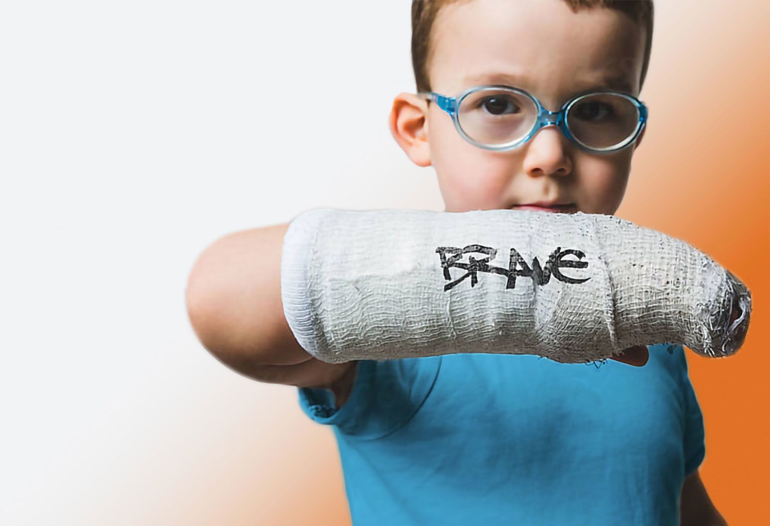 a young boy shows off his courageous injury, proving he his brave